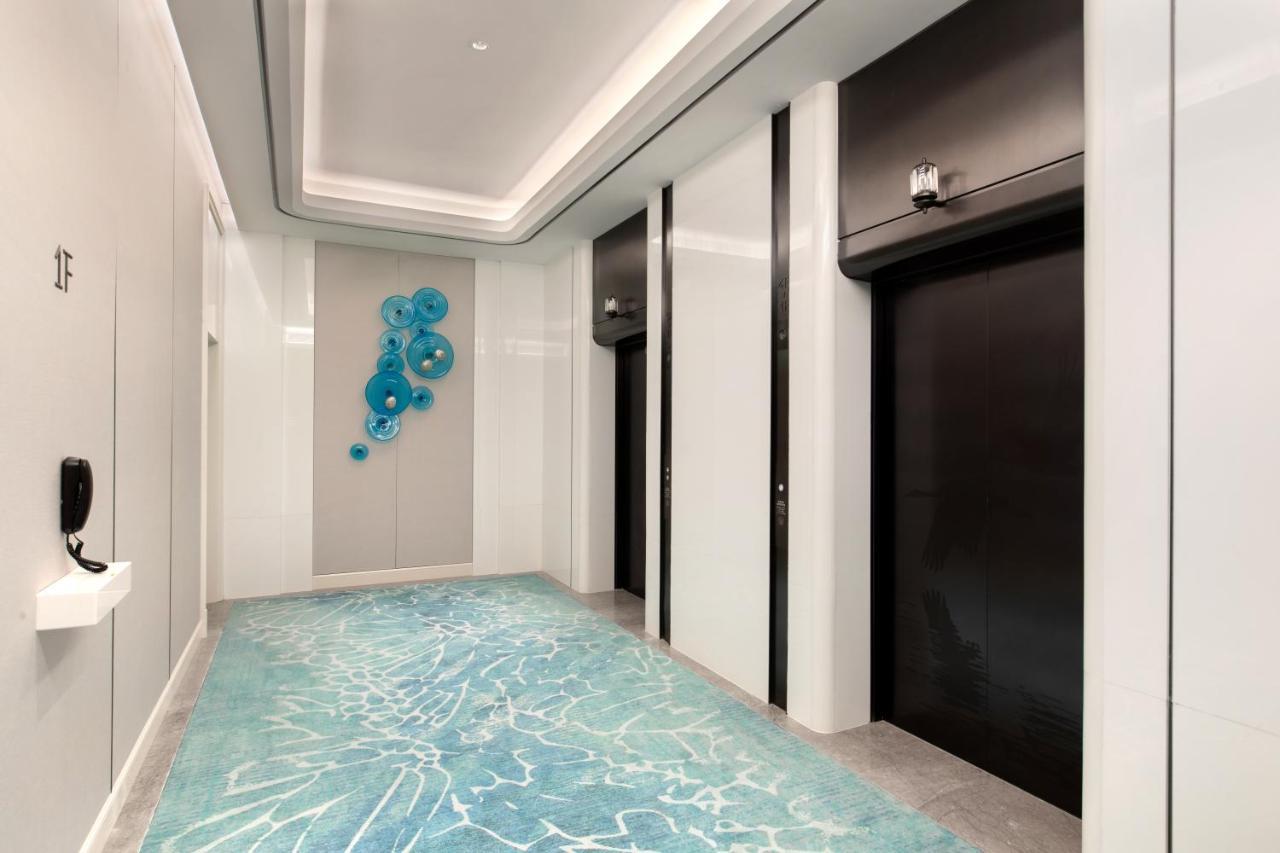 Xiamen International Seaside Hotel -Hotel Corridor Leads To The Stone Exhibition Hall Exterior photo
